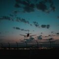 silhouette of wind turbines during sunset